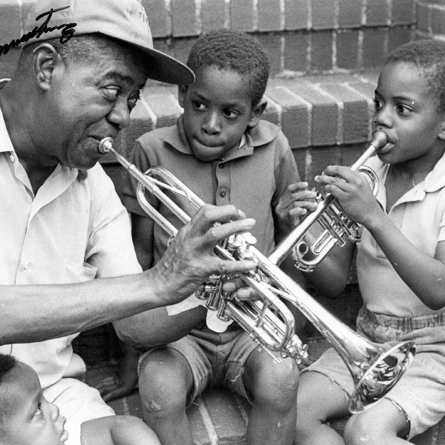 Louis Armstrong playing trumpet with the neighborhood kids